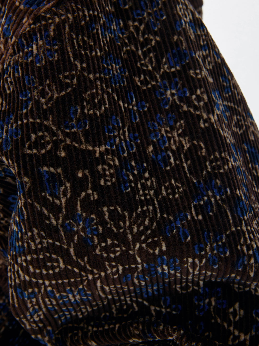 Close-up of a textured fabric with blue and black pattern