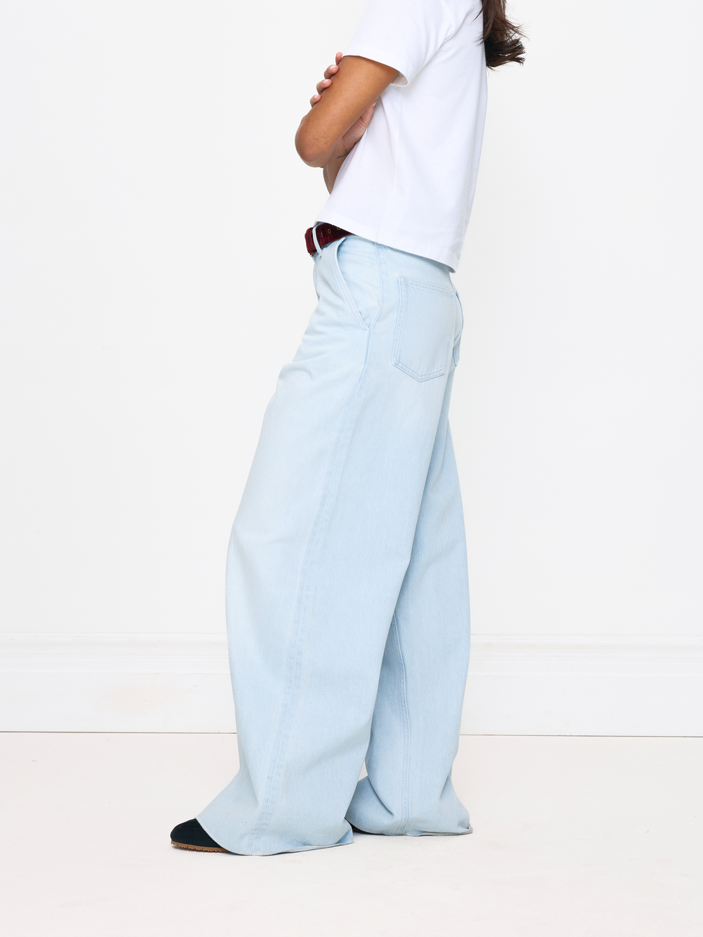 Light blue pants worn by a person on a white background